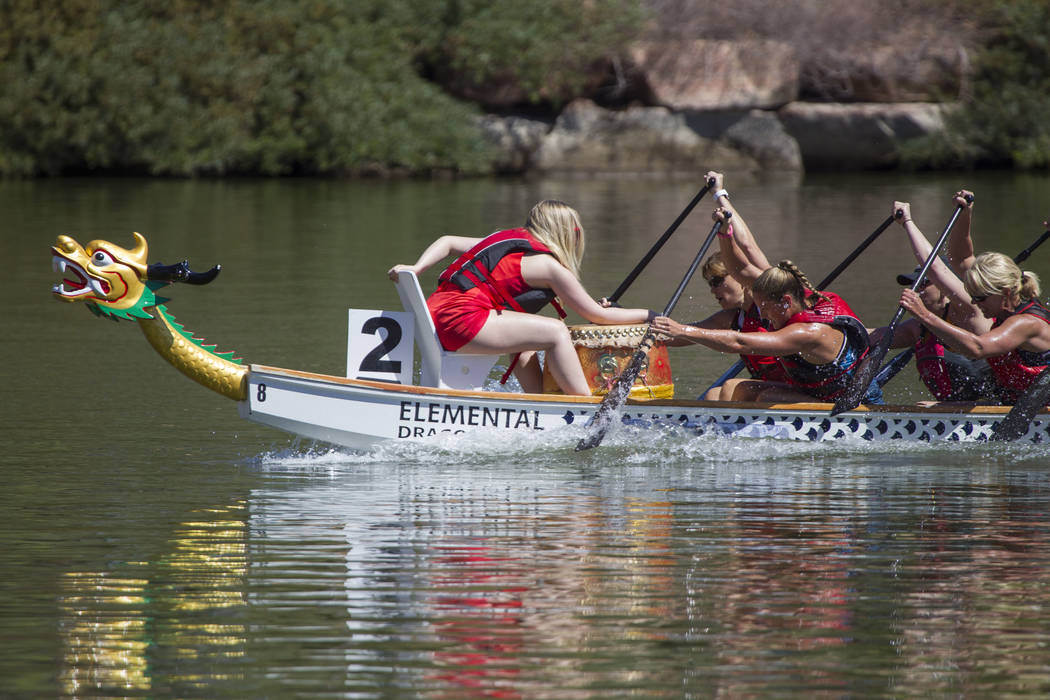 Members of the Skittles dragon boat race team participate in a race during the Nevada Internati ...