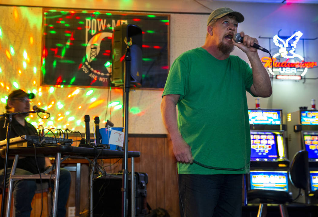 Ron Cochran sings some country music while joining a group of friends during their weekly karao ...