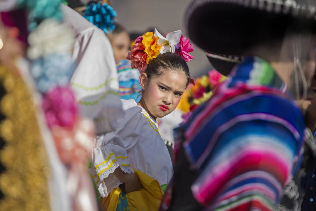 Dancers with Federación de Poblanos en Las Vegas get ready to go on stage during a Cinco de Ma ...