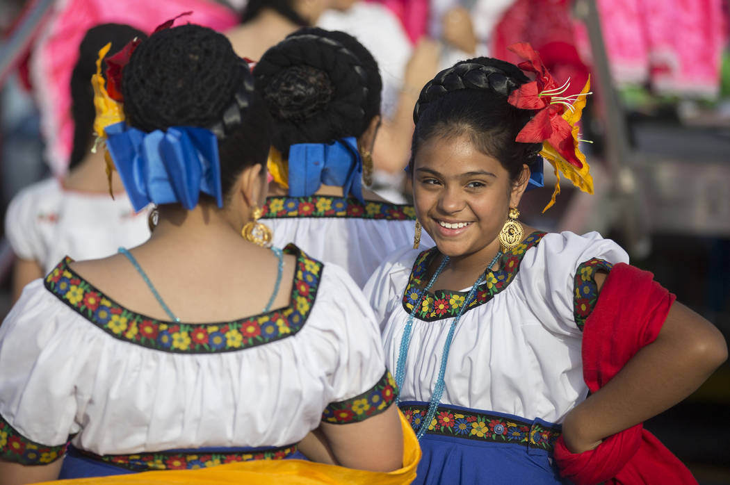 Dancers with Federación de Poblanos en Las Vegas get ready to go on stage during a Cinco de Ma ...