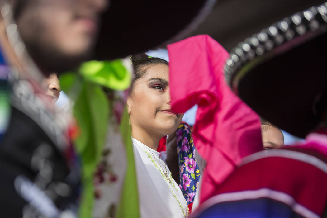 Dancers with Federación de Poblanos en Las Vegas get ready to go on stage during a Cinco de Ma ...