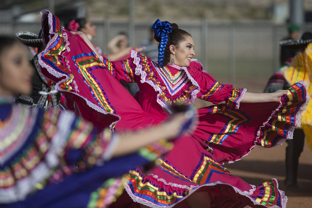 Naahi Ramirez, middle, a dancer with Federación de Poblanos en Las Vegas performs during a Cin ...