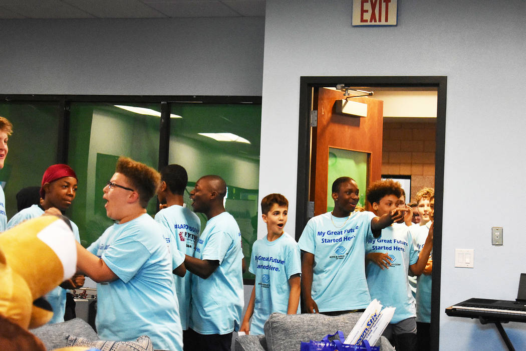 Teenagers of the Southern Highlands Boys and Girls club walk into their newly renovated Teen Ce ...