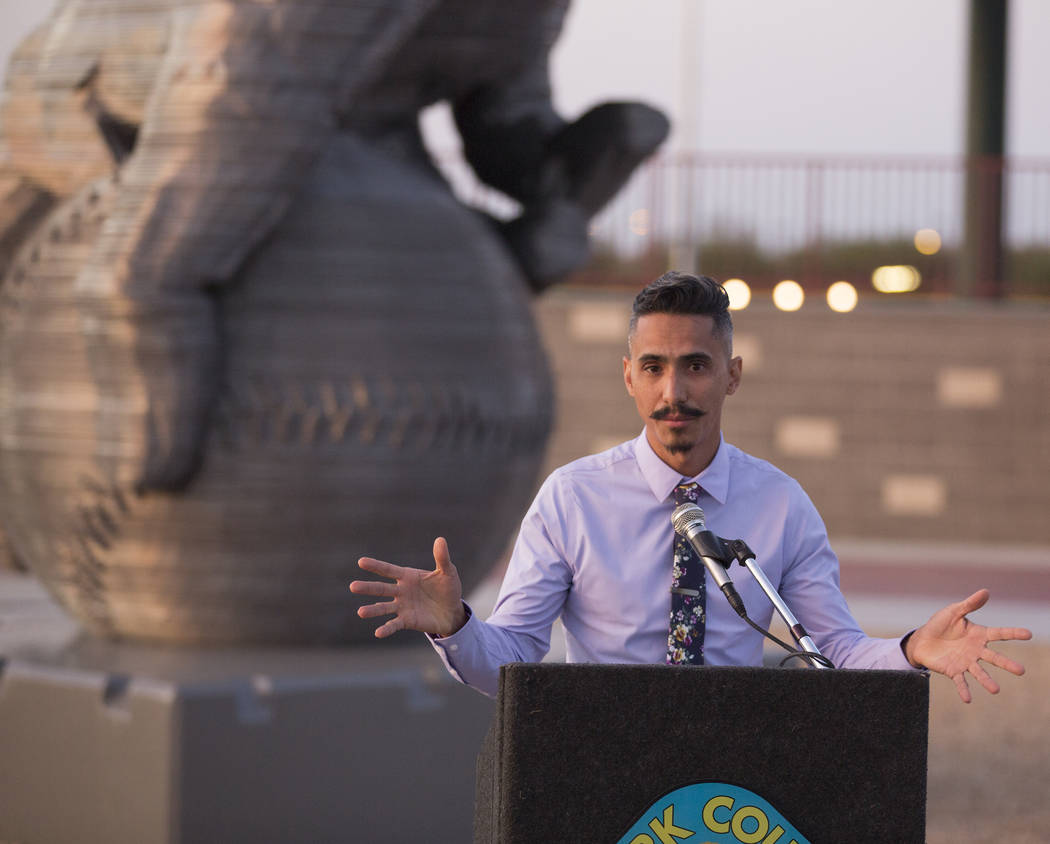 Artist Luis Varela-Rico speaks during a dedication ceremony for his sculpture "Organic Stu ...