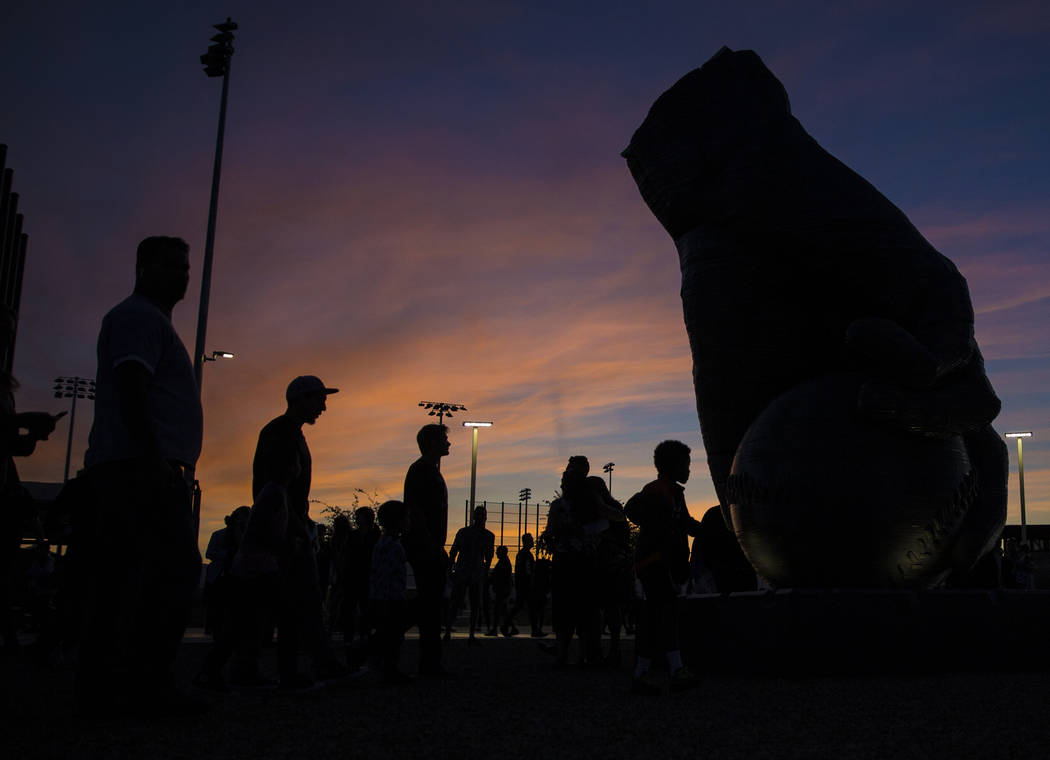 People view artist Luis Varela-Rico's sculpture "Organic Study No. 2" at sunset durin ...