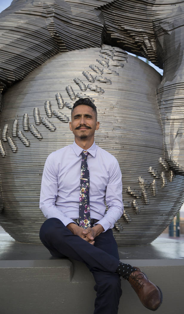 Artist Luis Varela-Rico with his sculpture "Organic Study No. 2" during a dedication ...