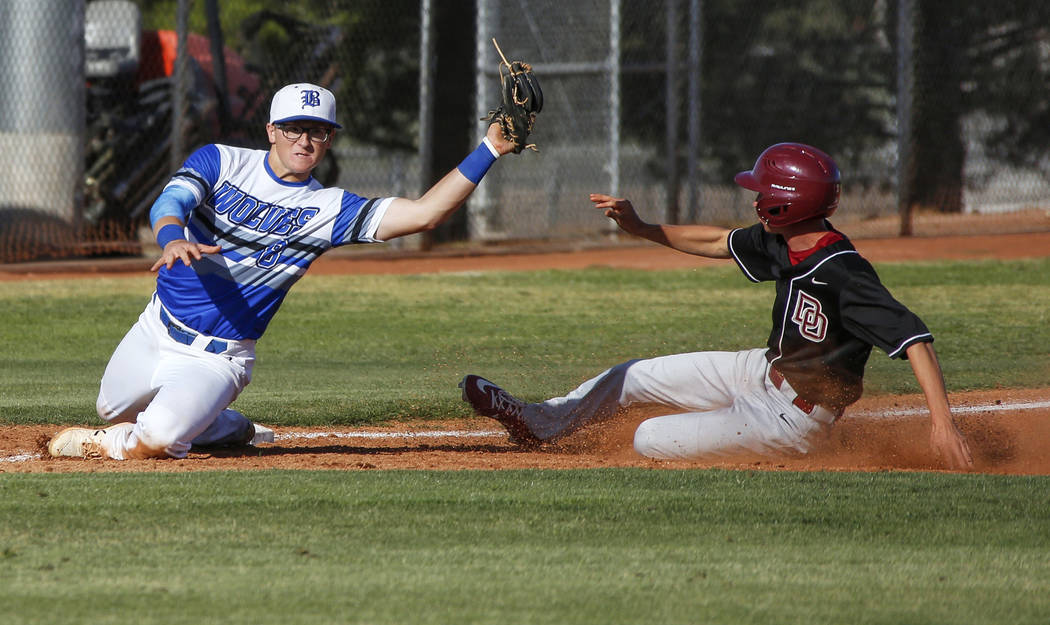 Basic third baseman Kyle Turner (8) catches the ball getting out Desert Oasis outfielder Jordan ...