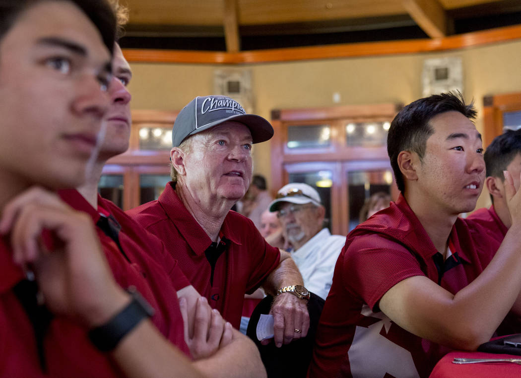 UNLV men's golf head choach Dwaine Knight, center, waits with his team to hear where they will ...