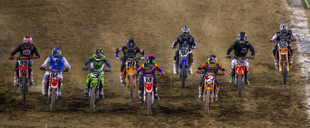 Red plate points leader Cooper Webb (2) starts out strong during the featured 450 SX class race ...