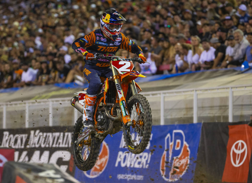 Red plate points leader Cooper Webb (2) takes a big jump as he leads the pack during the featur ...