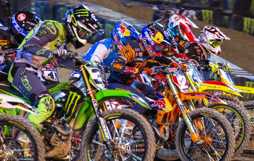 Red plate points leader Cooper Webb (2) takes off at the start during the featured 450 SX class ...