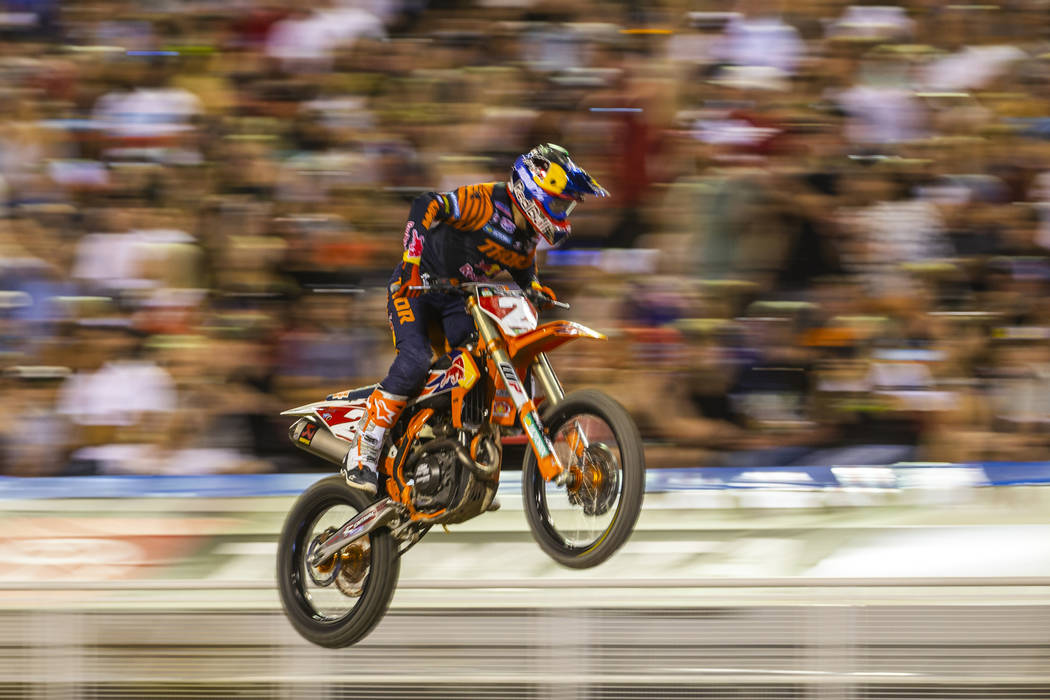 Red plate points leader Cooper Webb (2) soars past the crowd during the featured 450 SX class f ...
