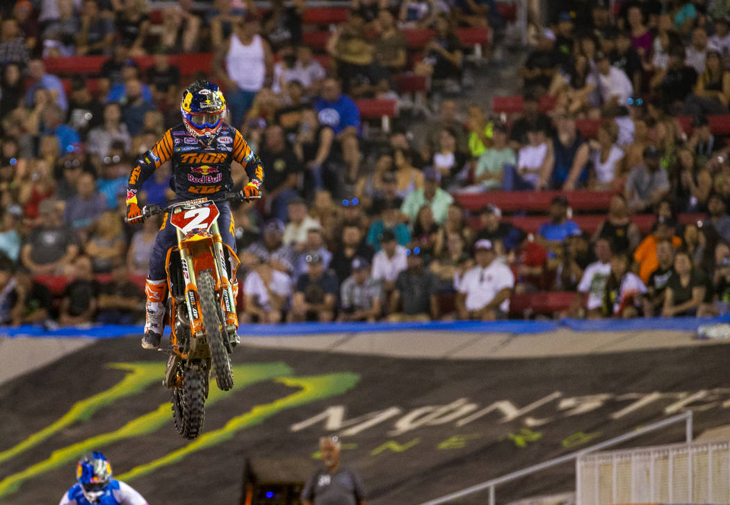 Red plate points leader Cooper Webb (2) catches some air during the featured 450 SX class final ...