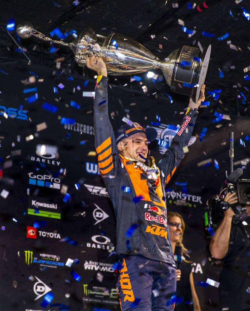 Red plate points leader Cooper Webb (2) celebrates his championship by hoisting the trophy foll ...