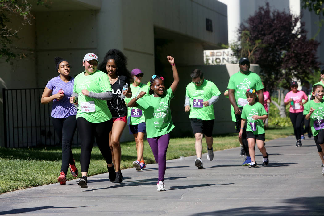 Participants run at the Girls on the Run Las Vegas 5K at UNLV in Las Vegas, Sunday, May 5, 2019 ...