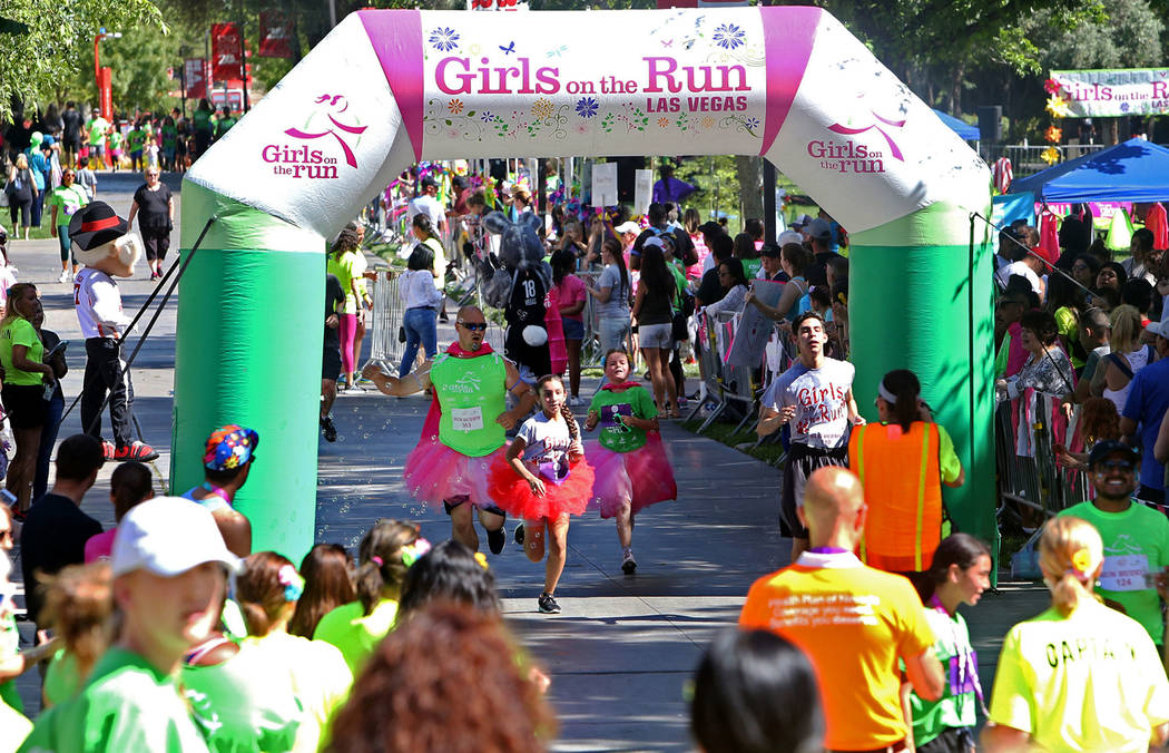 Participants run at the Girls on the Run Las Vegas 5K at UNLV in Las Vegas, Sunday, May 5, 2019 ...