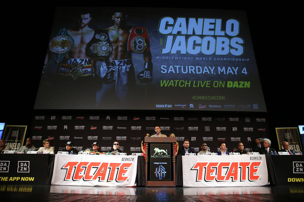 Boxing promoter Oscar De La Hoya, center, speaks during a press conference for the upcoming tit ...