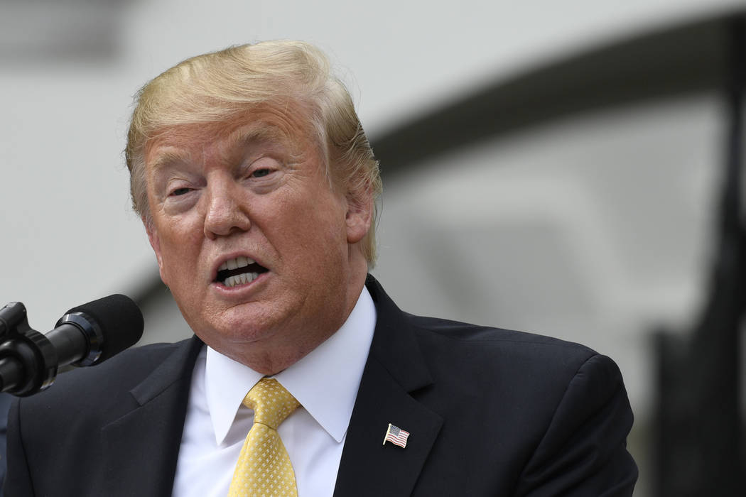 President Donald Trump speaks on the South Lawn of the White House in Washington, Tuesday, Apri ...