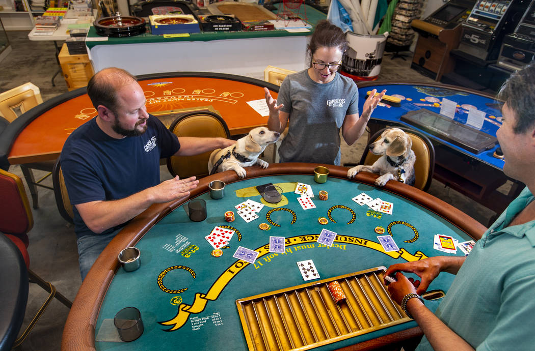 Adam Pennell with dog George and Jill Delozier with dog Molly of the Gamblers General Store pla ...