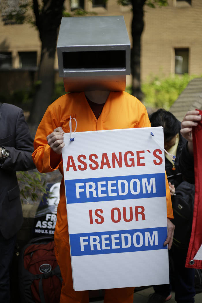 Protesters outside court as Julian Assange will appear to be sentenced on charges of jumping Br ...