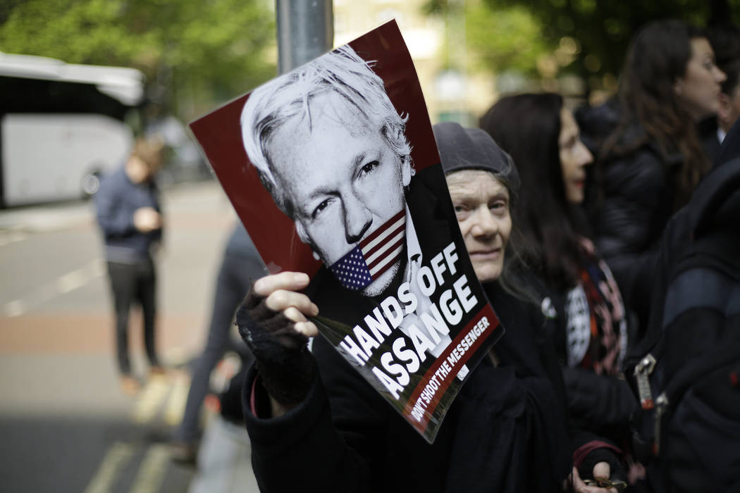 Protesters outside court as Julian Assange will appear to be sentenced on charges of jumping Br ...