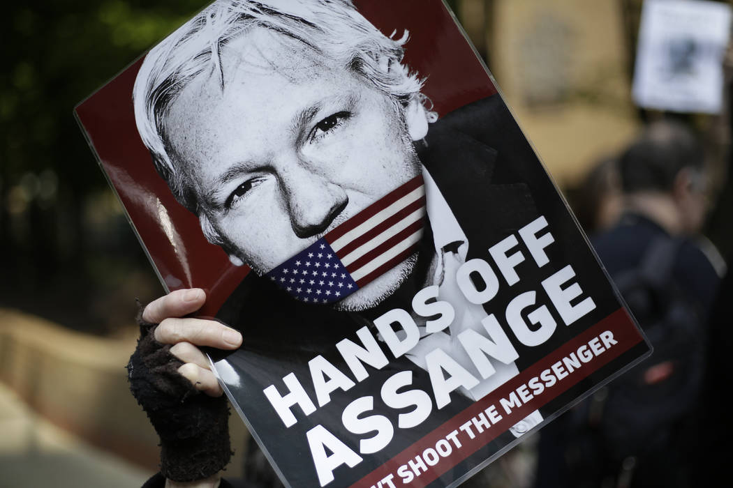 Protesters outside court as Julian Assange will appear to be sentenced on charges of jumping Br ...