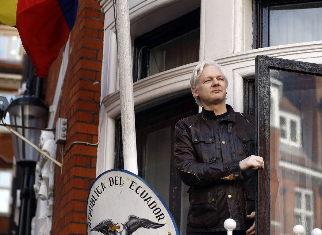 FILE - In this Friday, May 19, 2017 file photo, WikiLeaks founder Julian Assange looks out from ...