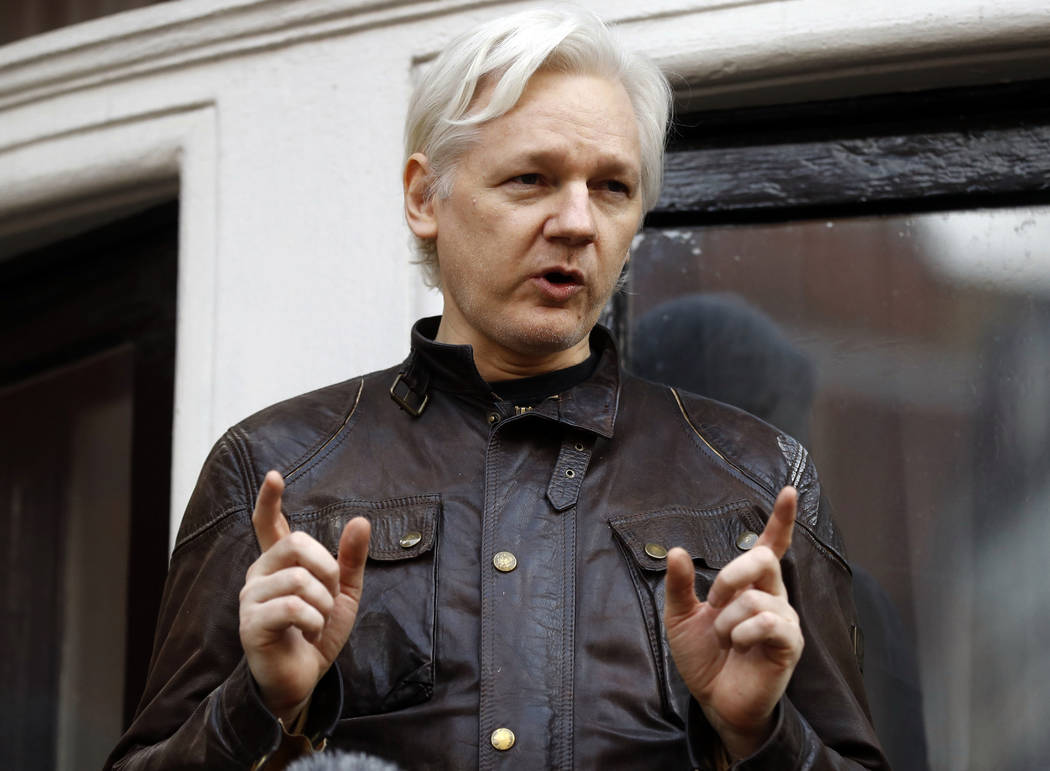 FILE - In this May 19, 2017 file photo, WikiLeaks founder Julian Assange gestures to supporters ...