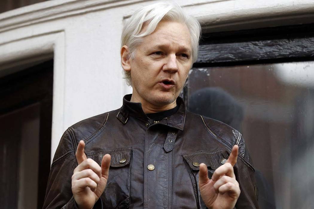 WikiLeaks founder Julian Assange gestures May 19, 2017, to supporters outside the Ecuadorian em ...