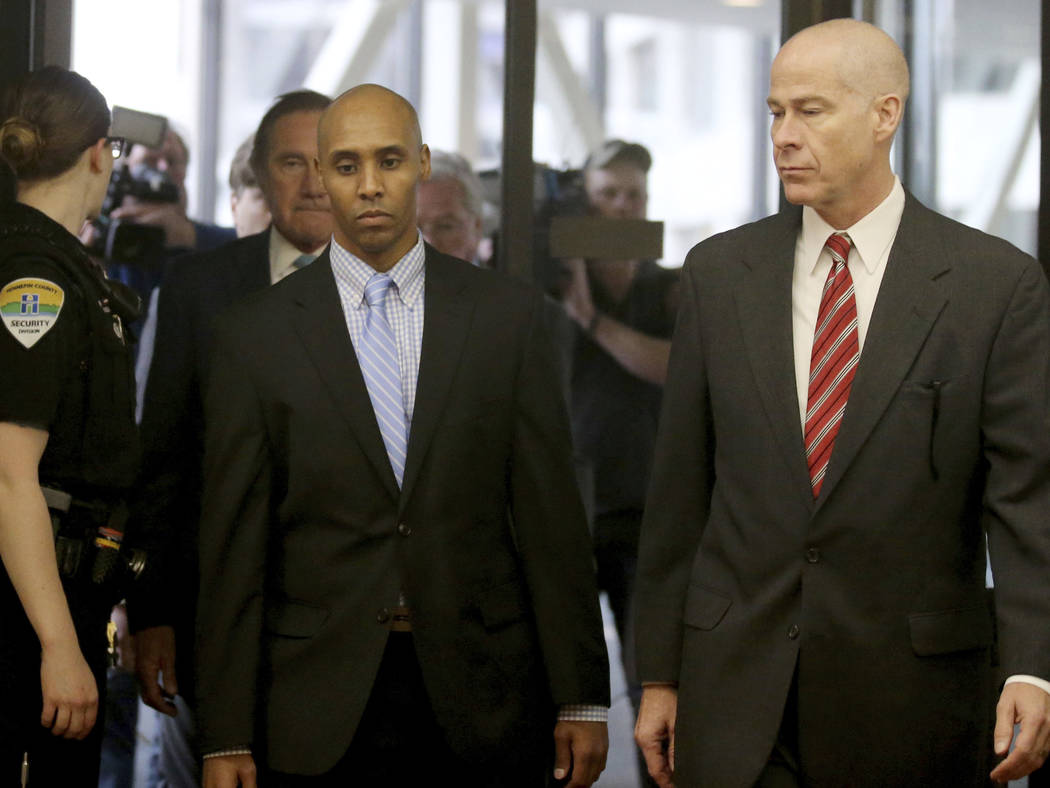 Former Minneapolis police officer Mohamed Noor walks through the skyway with his attorney Thoma ...