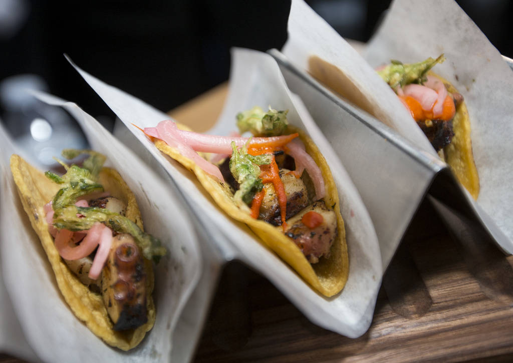 Tako tacos with grilled octopus, romesco, IPA pickled onions and beer battered fried cilantro b ...