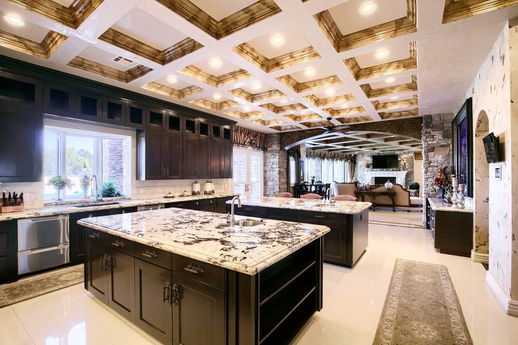 Signature Real Estate Group The kitchen has two islands. One for food prep and the other for so ...