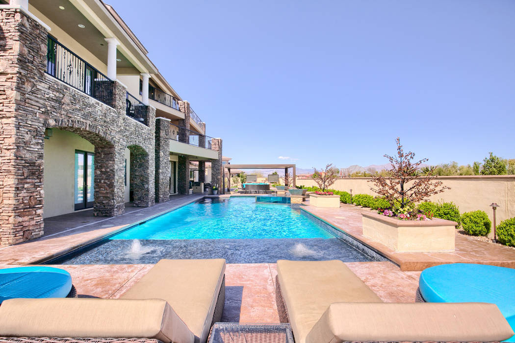 The four-story home features a 60-foot pool. (Signature Real Estate Group)