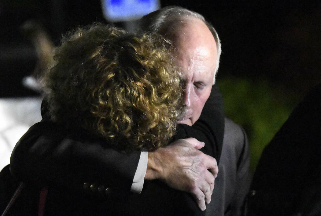 University of North Carolina Charlotte Chancellor Philip DuBois receives a hug after a news con ...