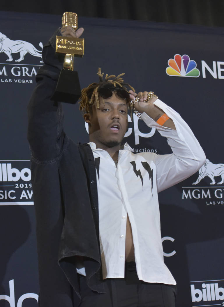 Juice Wrld poses in the press room with the award for top new artist at the Billboard Music Awa ...