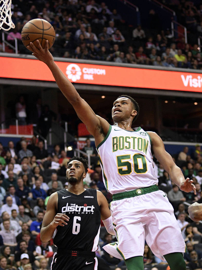 In this Tuesday, April 9, 2019, file photo, Boston Celtics guard P.J. Dozier (50) goes to the b ...