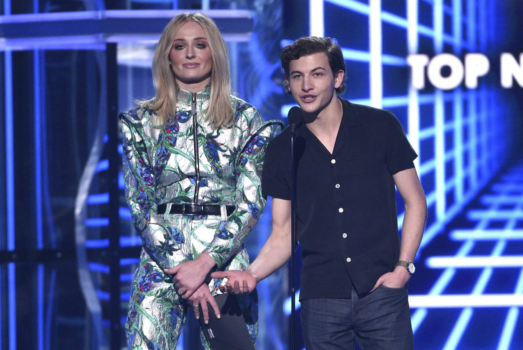 Sophie Turner, left, and Tye Sheridan present the award for top new artist at the Billboard Mus ...