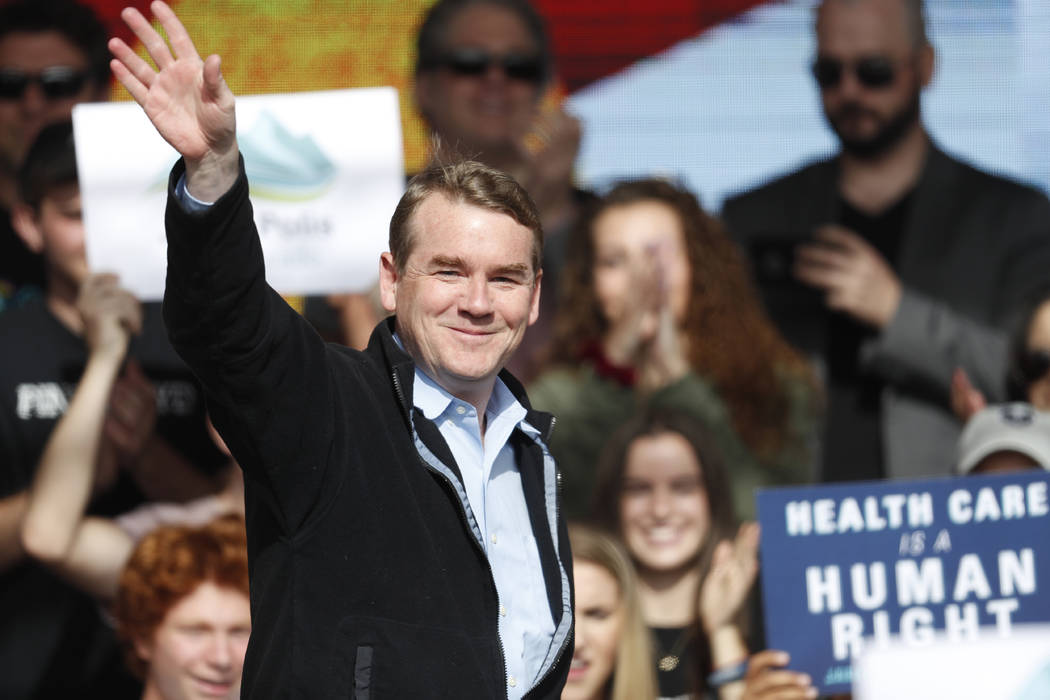 U.S. Senator Michael Bennet, D-Colo., greets voters during a rally with young voters Oct. 24, 2 ...