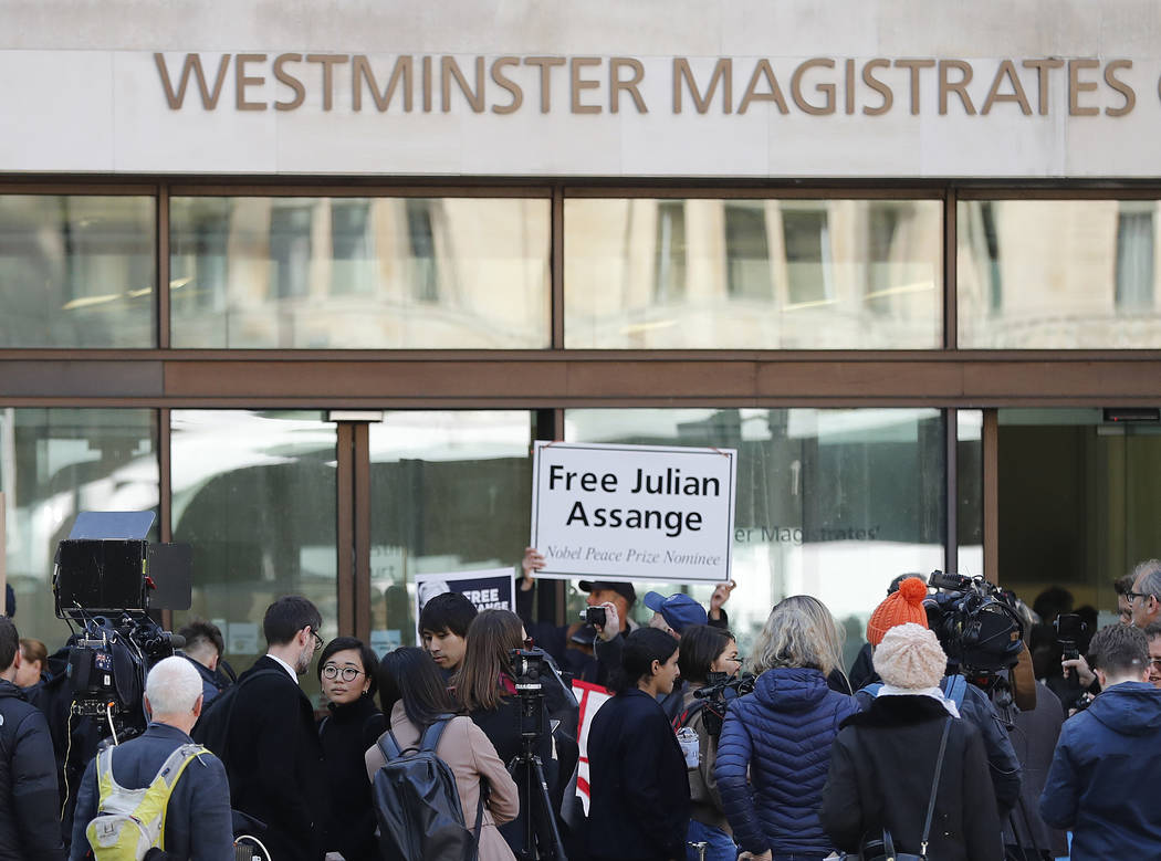 Media and supporters wait at the entrance of Westminster Magistrates Court in London, Thursday, ...