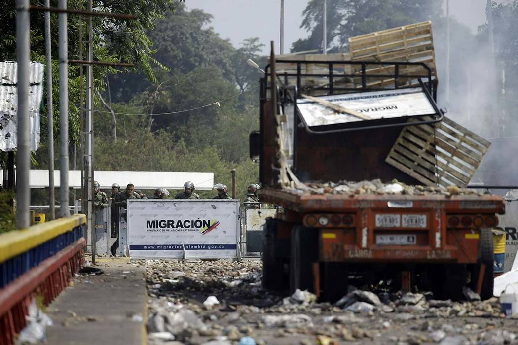 Venezuelan National Guards block their side of the Francisco de Paula Santander International B ...