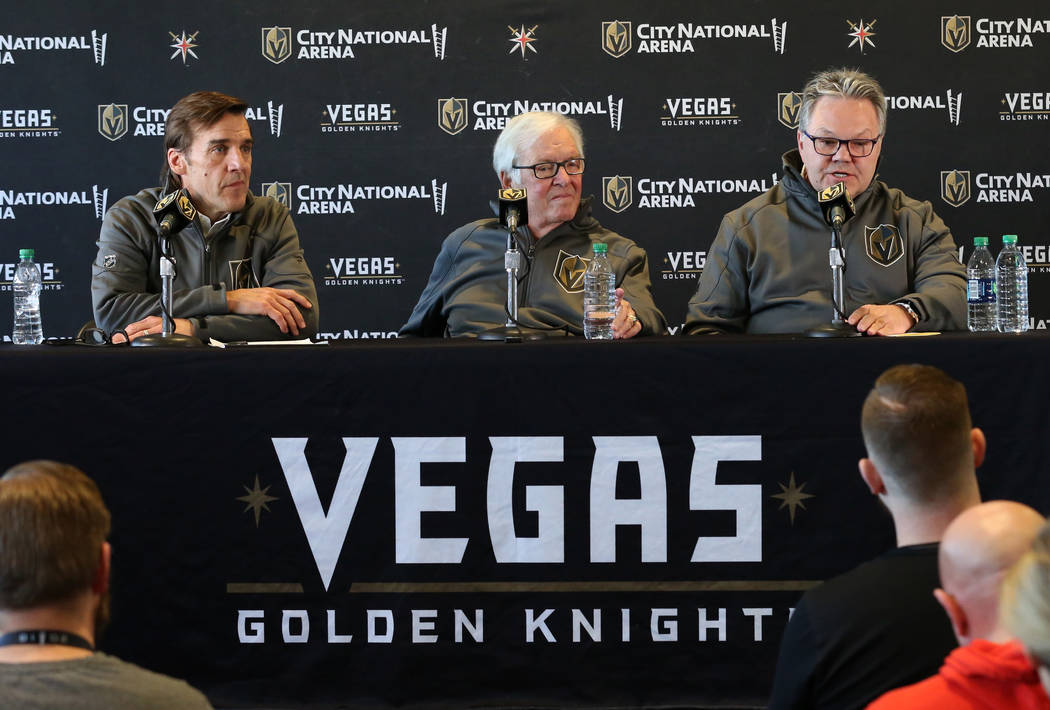 Golden Knights owner Bill Foley, center, and president of hockey operations George McPhee, left ...
