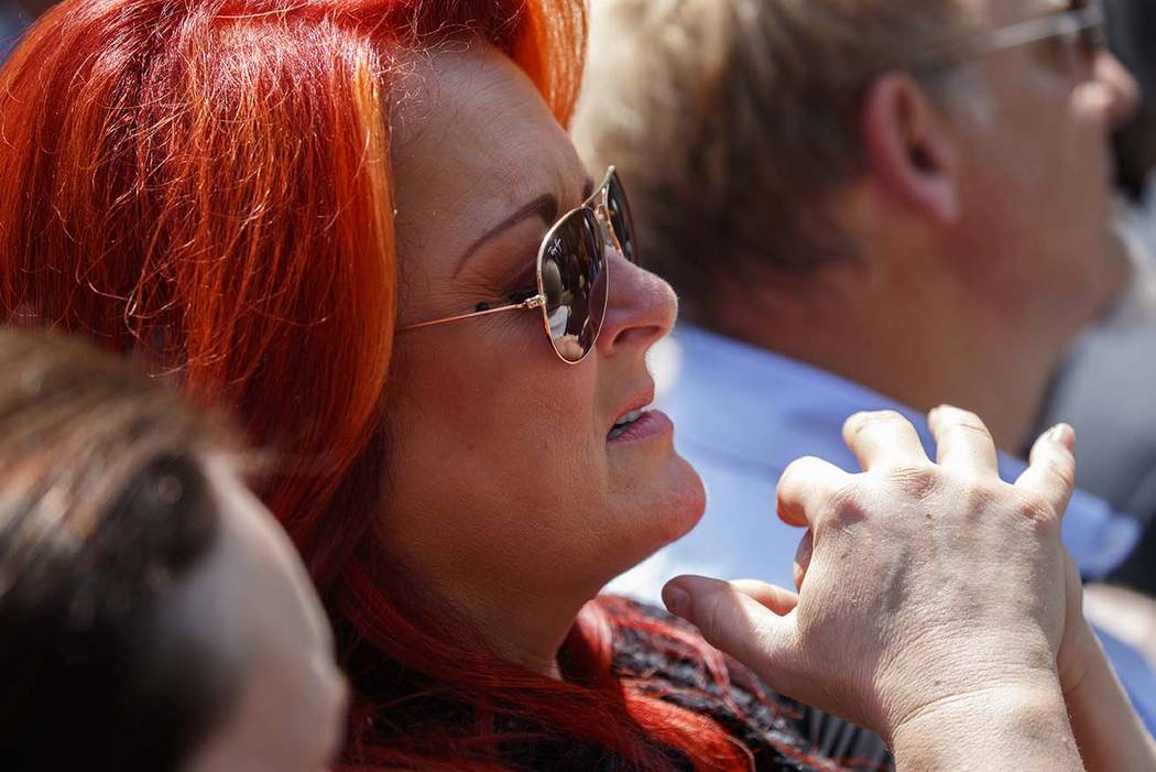 Musician Wynonna Judd listens as President Donald Trump speaks during a National Day of Prayer ...