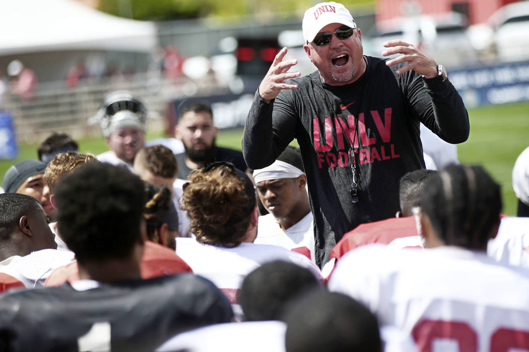 UNLV Rebels head coach Tony Sanchez talks with his team after the spring football game at Pete ...