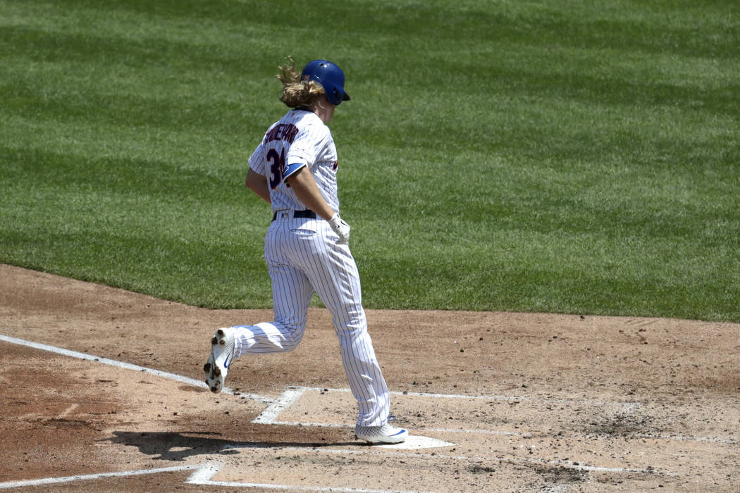 New York Mets' Noah Syndergaard touches home plate after hitting a solo home run off Cincinnati ...