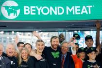 Ethan Brown, center, CEO of Beyond Meat, attends the Opening Bell ceremony with guests to celeb ...