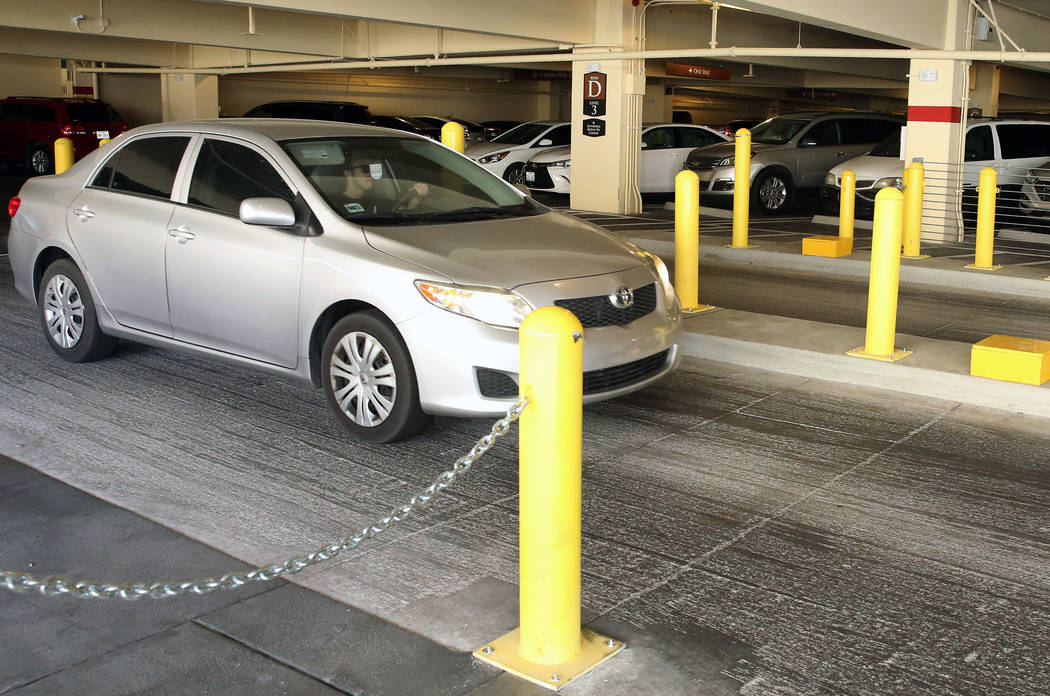 A guest drives through metal and concrete barriers as he leaves the Wynn Las Vegas parking gara ...