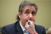 President Donald Trump's former personal lawyer Michael Cohen listens Feb. 27, 2019, to a quest ...