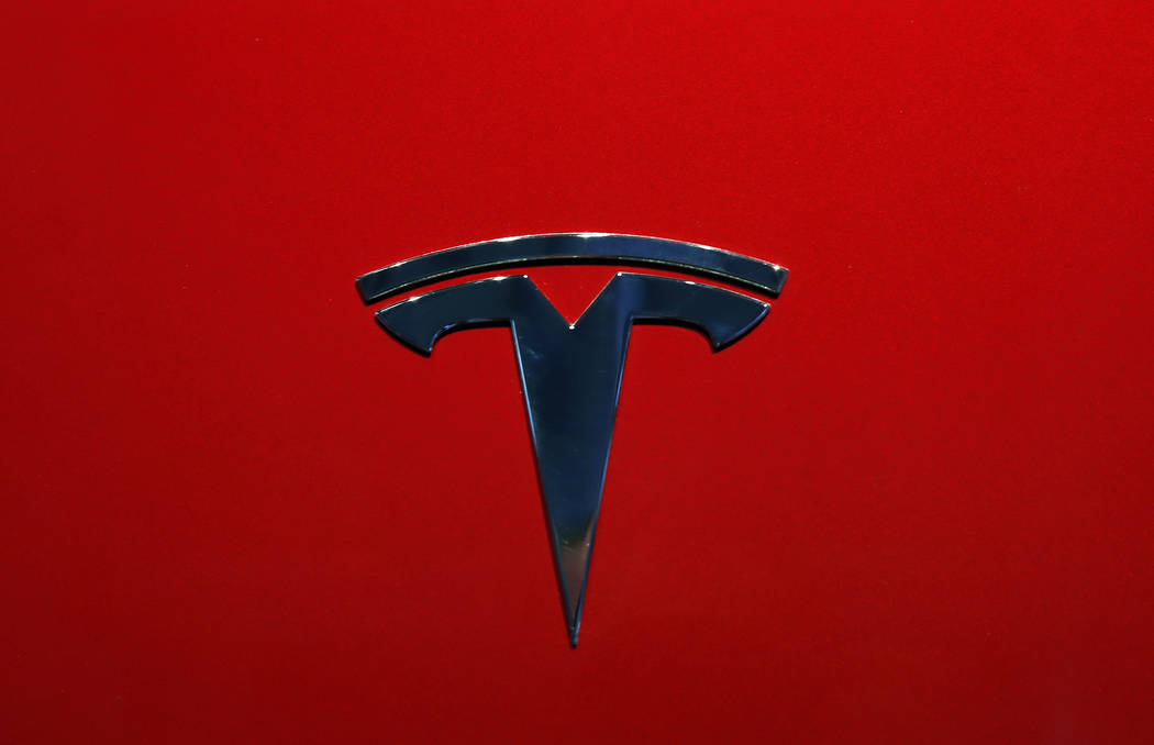 A Oct. 3, 2018, file photo shows the logo of Tesla model 3 at the Auto show in Paris. Tesla is ...