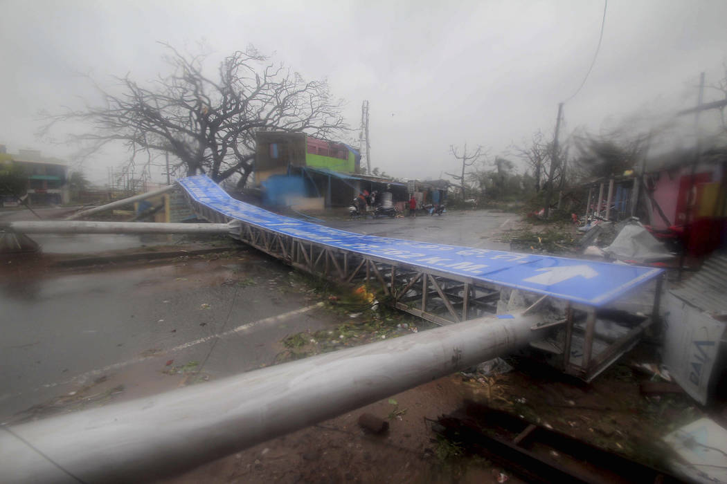 Damaged signage lies on a street in Puri district after Cyclone Fani hit the coastal eastern st ...