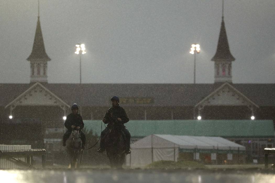 Horses come off the track after an early-morning workout at Churchill Downs Friday, May 3, 2019 ...